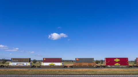 A freight train with double-stacked containers
