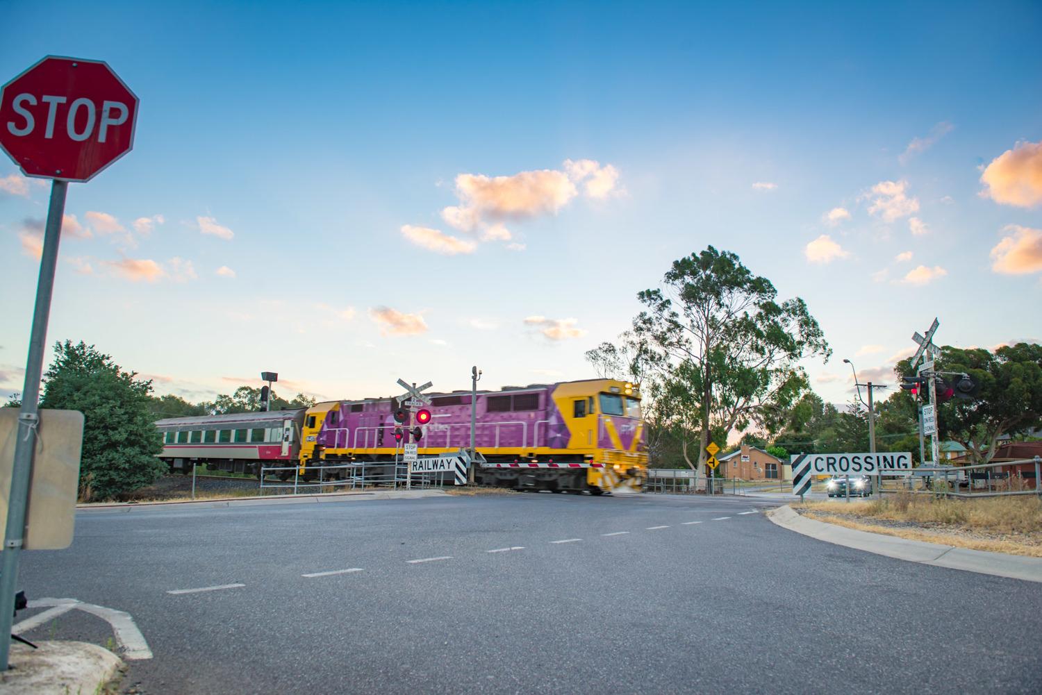 Seymour level crossing with a train passing through.