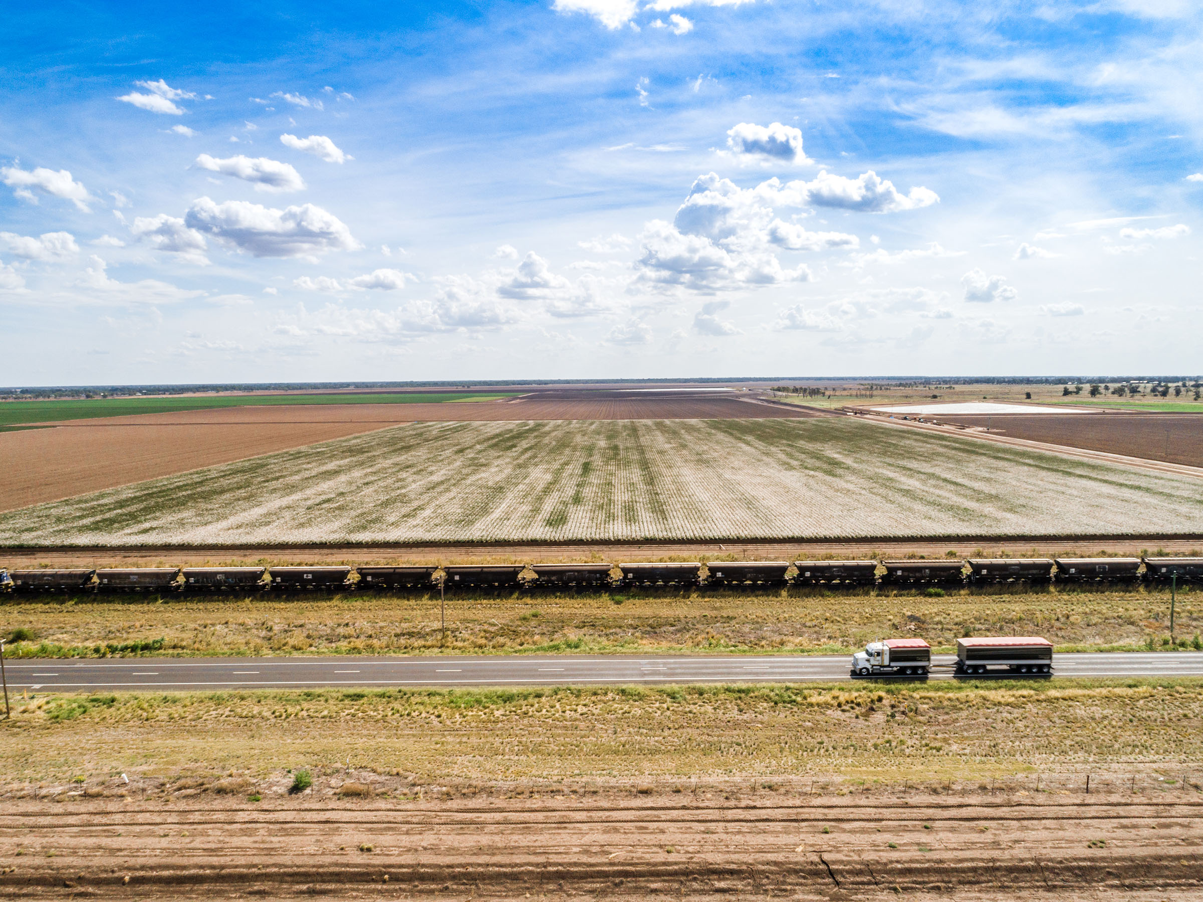 Aerial view of the freight train moving along the farmland, North Star, New South Wales