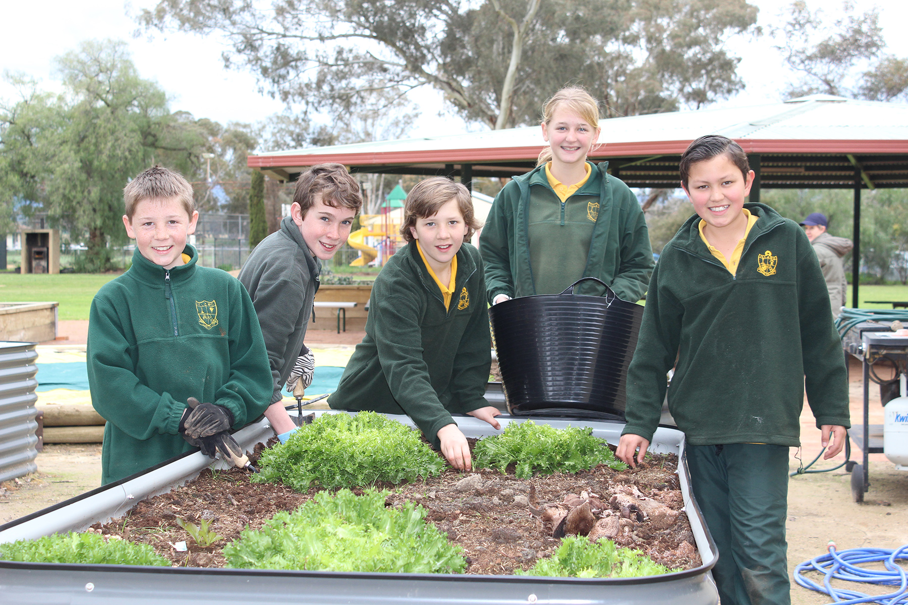 Illabo Public School students in front of their new garden pot