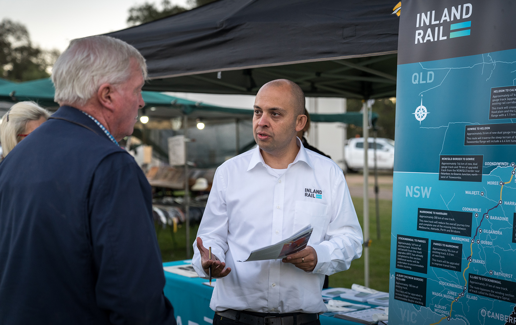 Stakeholder Engagement team member talking to community member at the 2019 Coonamble Show, New South Wales.