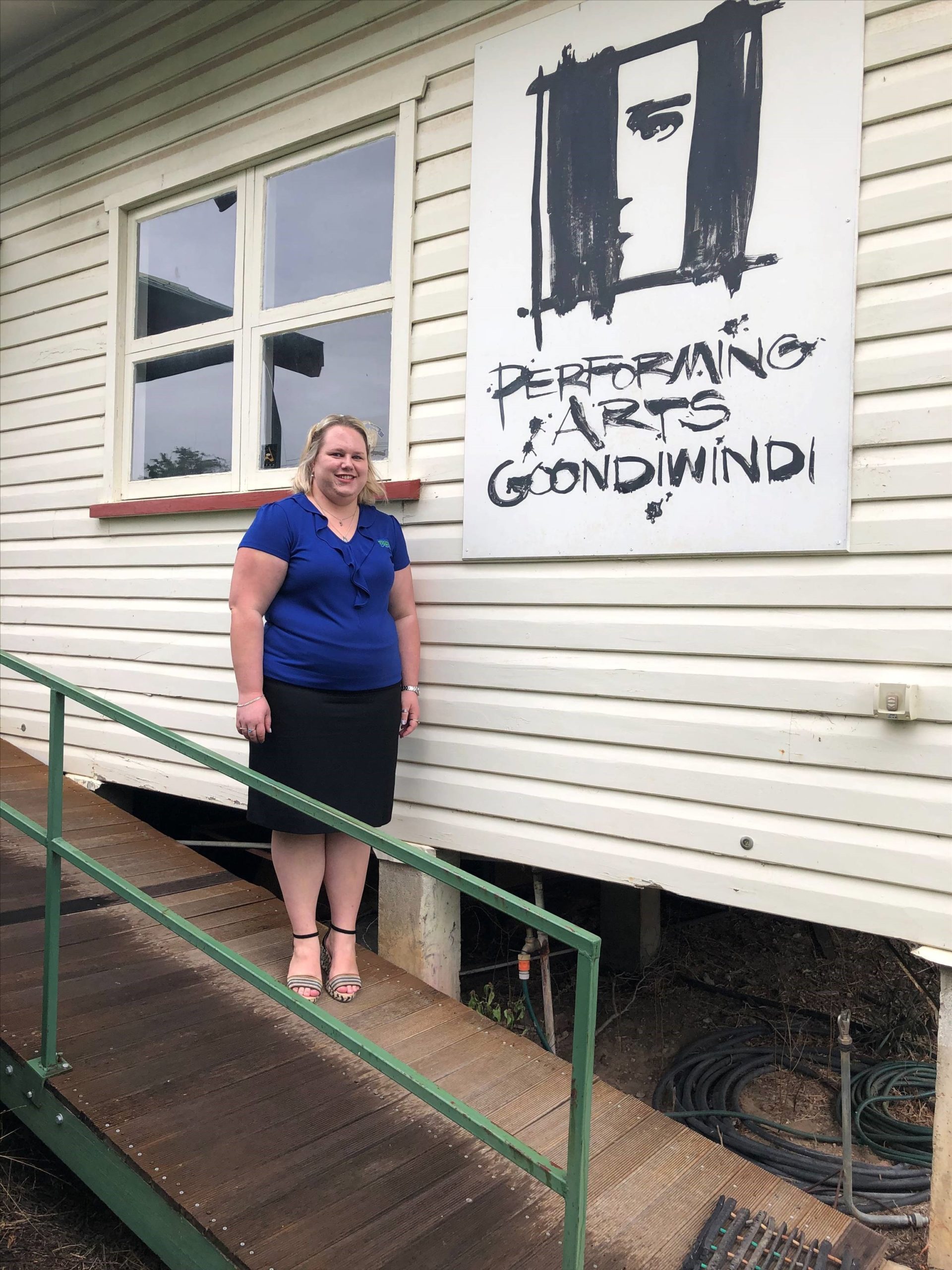 Performing Arts Goondiwindi Secretary Lauren McVicar standing out the front of the group’s hut