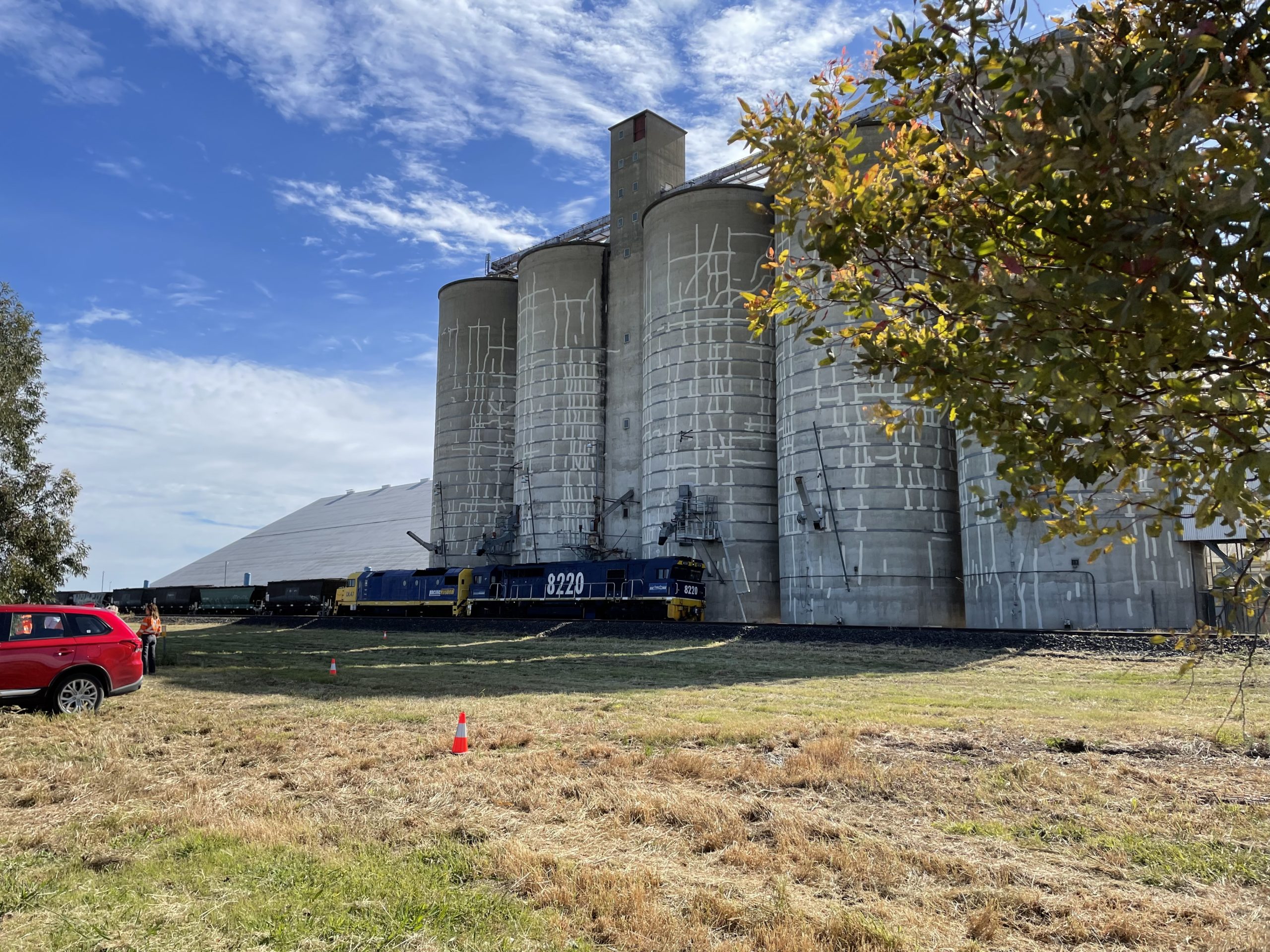 train next to grain silos on new section of track between Narrabri to North Star