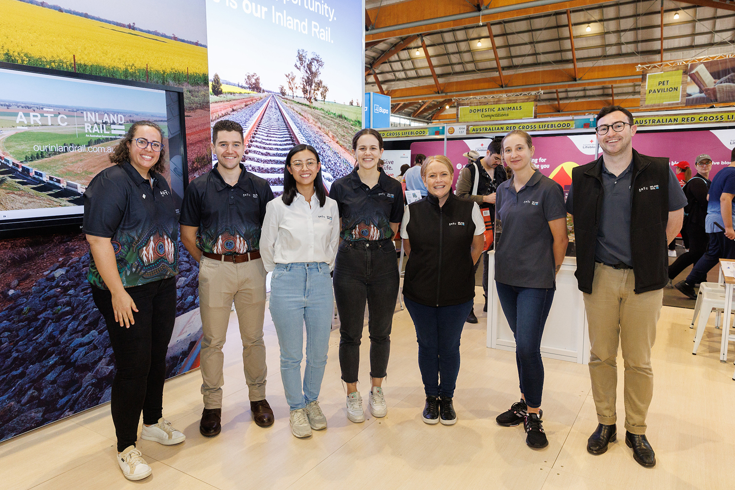 Image of Inland Rail employees in front of the Inland Rail exhibition booth at the 2023 Sydney Royal Easter Show
