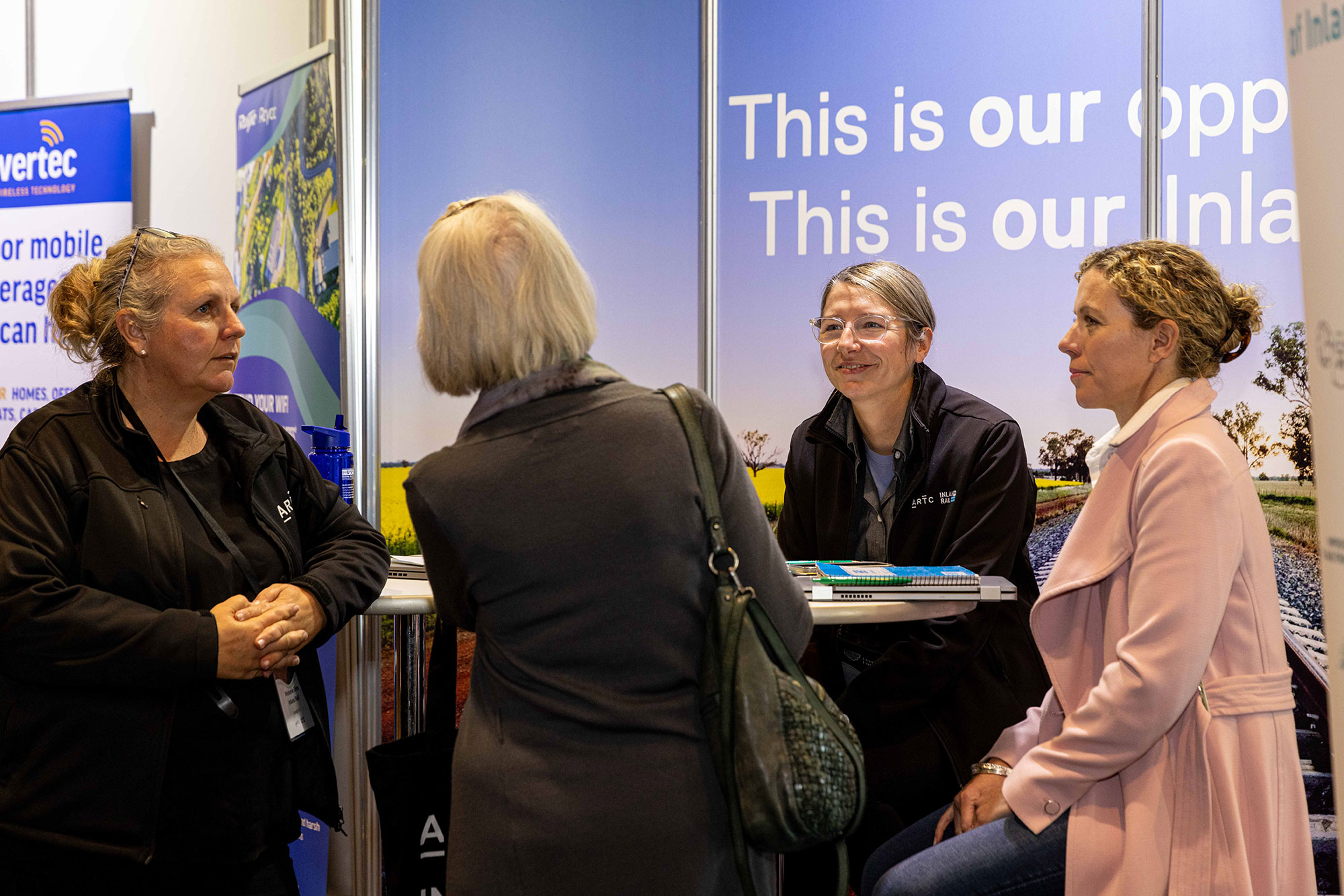 Members of Inland Rail’s Stakeholder Engagement Team speaking with a conference delegate at the NSW Farmers’ Association 2023 Annual Conference