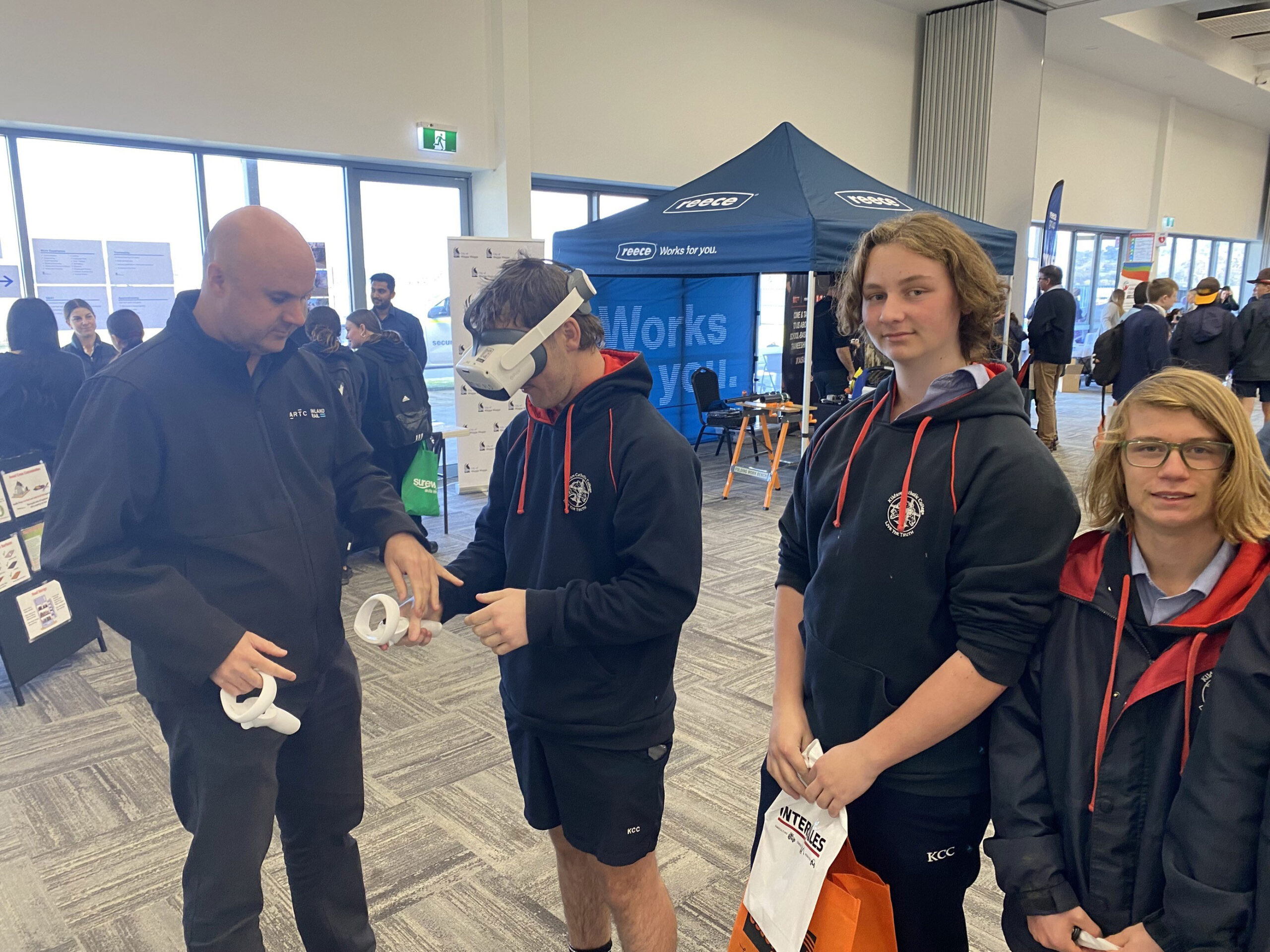 Students at the Wodonga Jobs Expo testing out the virtual reality headset at the Inland Rail stand