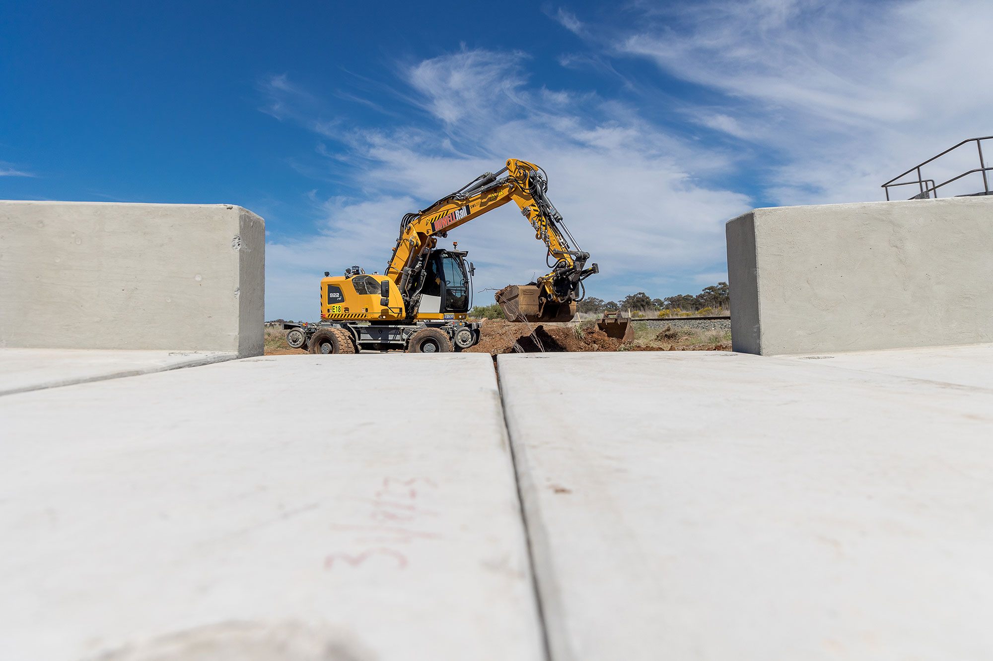 A track machine completing culvert works on the Stockinbingal to Parkes section of the Inland Rail project
