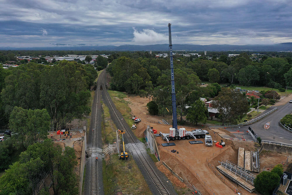 A crane stands next to the railway track at Wangaratta after removing an old bridge.