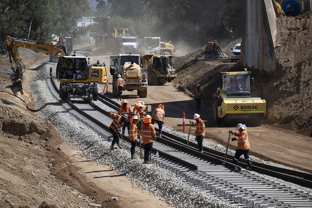 A construction site showing workers constructing and rehabilitating a rail line in Victoria.